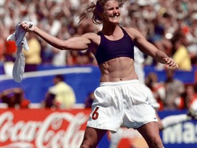 FILE - In this July 10, 1999, file photo, the United States' Brandi Chastain celebrates by taking off her jersey after kicking in the game-winning goal in a penalty shootout against China in the FIFA Women's World Cup Final at the Rose Bowl in Pasadena, Calif. Social media is finding little to like about the likeness on a plaque honoring the retired soccer champion. The Bay Area Sports Hall of Fame in San Francisco unveiled the plaque on Monday, May 21, 2018. Chastain diplomatically said "it's not the most flattering. But it's nice."