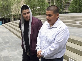 FILE - In this Tuesday, May 1, 2018 file photo Daniel Ramirez Medina, right, walks with a man identified as his brother following a hearing in U.S. District Court in Seattle. A federal judge in Seattle has at least temporarily blocked the government from revoking Medina's enrollment in a program designed to protect those brought to the United States illegally as children. Medina's participation in the Deferred Action for Childhood Arrivals program was due to expire Tuesday, May 15, 2018, U.S. District Judge Ricardo S. Martinez ordered U.S. Citizenship and Immigration Services to maintain Medina's status.