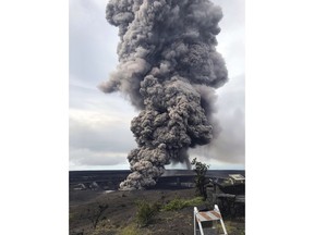 This photo provided by the U.S. Geological Survey shows an ash column rising from the overlook at Halema'uma'u Crater at the summit of Kilauea Volcano in Hawaii Volcanoes National Park on the island of Hawaii at 8:29 a.m. HST Wednesday, May 9, 2018. Hawaii Volcanoes Observatory interprets the short-lived explosion was triggered by a rockfall from the steep walls of the crater. (U.S. Geological Survey via AP)