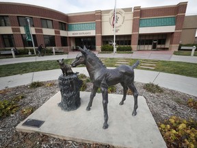 FILE - In this Nov. 6, 2017 file, photo, a sculpture stands outside the front door of the veterinary school at Colorado State University in Fort Collins, Colo. The mother of two Native American teenagers who campus police pulled from a Colorado State University campus tour after a parent reported feeling nervous about them said she believes her sons were victims of racial profiling and she feared for their safety after learning about the encounter.
