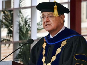 In this May 12, 2017 photo University of Southern California, USC President C.L. Max Nikias presides at commencement ceremonies on the campus in Los Angeles. Nikias has agreed to step down amid a sex scandal involving a school gynecologist. A letter to faculty members on Friday, May 25, 2018, that was obtained by The Associated Press, said the school's board of trustees had "agreed to begin an orderly transition" and begin searching for a new president. The letter did not say when Nikias would leave his post.