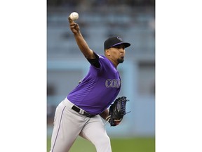 Colorado Rockies starting pitcher German Marquez throws to the plate during the first inning of a baseball game against the Los Angeles Dodgers Monday, May 21, 2018, in Los Angeles.