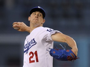 Los Angeles Dodgers starting pitcher Walker Buehler throws to a Cincinnati Reds batter during the first inning of a baseball game Thursday, May 10, 2018, in Los Angeles.
