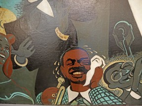 A detail of the oil on canvas painting Dixie's Bar of Music is seen at the New Orleans Jazz Museum in New Orleans, Thursday, May 10, 2018. The 29-foot-long painting that caricatures more than 60 musical celebrities of the 1940s is back in a New Orleans museum. The painting covered a wall at Dixie's Bar of Music, a haven for gays during a homophobic era. It's been in storage since 2005's Hurricane Katrina but is now the focus of a new display at the museum in the Old U.S. Mint.