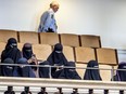 Women wearing the islamic veil niqab sit in the audience seats of the Danish Parliament, at Christiansborg Castle, in Copenhagen, Denmark, Thursday May 31. 2018.
