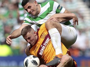 Celtic's Tom Rogic, right, vies with Motherwell's Allan Campbell during the Scottish Cup soccer final match, at Hampden Park, Glasgow, Scotland, Saturday, May 19, 2018.