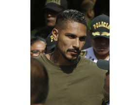 Peru captain Paolo Guerrero arrives in Lima, Peru, Tuesday, May 15, 2018. The global footballers' union wants FIFA's help to review anti-doping rules after Guerrero was banned from the World Cup for a positive test for cocaine caused by contaminated tea. FIFPro says a 14-month ban barring the 34-year-old Guerrero from his World Cup debut is "unfair and disproportionate."