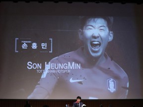 South Korea's national soccer team head coach Shin Tae-yong, center bottom, announces a name of Son Heung-min as a member of squad for the 2018 Russia World Cup during a press conference in Seoul, South Korea, Monday, May 14, 2018.