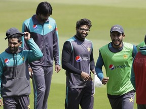 Pakistan's cricket team players laugh during a training session at Lord's cricket ground in London, Wednesday, May 23, 2018. England will play Pakistan in their first test match at Lord's starting Thursday.