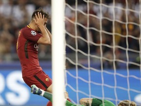 Roma's Cengiz Under reacts after he misses an opportunity to score during the Champions League semifinal second leg soccer match between Roma and Liverpool at the Olympic Stadium in Rome, Wednesday, May 2, 2018.