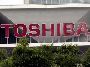 FILE - This May 26, 2017 file photo shows the company logo of Toshiba Corp. displayed in front of its headquarters in Tokyo. Japanese electronics company Toshiba Corp. says the sale of its computer memory chip business to a consortium led by Bain Capital Private Equity has cleared all anti-trust regulatory approval, including one it was awaiting from China. Toshiba said Thursday, May 17, 2018 that means the deal, valued at 2 trillion yen ($18 billion), can now close by June 1.