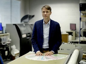 The founder and CEO of "My Nametags" Lars Andersen, originally from Norway, poses for photographs by a sheet label "weeding machine" at his business premises in London, Wednesday, May 23, 2018. Starting Friday, May 25, 2018, My Nametags and most other companies that collect or process the personal information of EU residents must comply with the new General Data Protection Regulation, which the EU calls the most sweeping change in data protection rules in a generation.