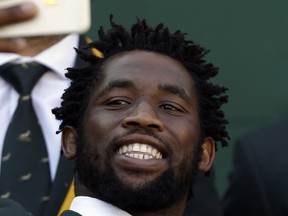 FILE - In this Friday, Sept. 11, 2015 file photo, South Africa's rugby player Siya Kolisi, takes a selfie with teammates during the team public farewell in Johannesburg, South Africa. Kolisi has become the first black player to be appointed captain of South Africa's test rugby team, it was reported on Monday, May 28, 2018. Kolisi has been named captain for the series against England next month.