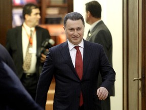 FILE - In this Friday, Dec. 30, 2016 file photo, Nikola Gruevski, leader of the conservative VMRO-DPMNE party that won the most seats in the parliamentary elections, arrives at the constitutive session in the parliament building in Skopje, Macedonia. A Macedonian criminal court on Wednesday May 23, 2018, has sentenced former conservative prime minister Nikola Gruevski to two years in prison for unlawfully influencing officials at the interior ministry over the purchase of a luxury bulletproof car.