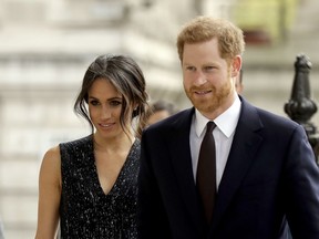 FILE - In this Monday, April 23, 2018 file photo, Britain's Prince Harry and his fiancee Meghan Markle arrive to attend a Memorial Service to commemorate the 25th anniversary of the murder of black teenager Stephen Lawrence at St Martin-in-the-Fields church in London. German royalists' adrenaline has been surging as the Saturday, May 19 wedding of Prince Harry and his American bride-to-be Meghan Markle is creeping closer. There's no way anybody here will be able to miss the event: Three German TV stations, ZDF, RTL and n-tv, will broadcast the event live and stream it on their websites too. Dozens of German correspondents are accredited and so-called "royal household experts" will explain the intricacies of the foreign ceremony.