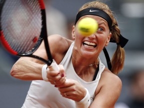 FILE - In this Saturday, May 12, 2018 file photo, Czech Republic's Petra Kvitova returns a ball to Kiki Bertens of the Netherlands during the Madrid Open tennis tournament final in Madrid, Spain. Kvitova won the final 7-6 (6), 4-6, 6-3. A Czech court ruled on Thursday May 24, 2018, a suspect in a knife attack on double Wimbledon champion Petra Kvitova will be taken into custody.