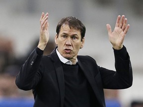 FILE - In this Tuesday, Jan. 16, 2018 file photo, Marseille's coach Rudi Garcia directs his players during the League One soccer match between Marseille and Strasbourg, at the Velodrome stadium, in Marseille, southern France. Marseille will play Atletico Madrid in the Europa League final on Wednesday May 16, 2018. Marseille now enjoys significant financial backing and the time is right to stop harping on about past glory and deliver another trophy. Atletico is bidding to win the Europa League for the third time this decade.