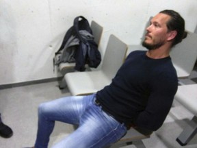 In this photo released Saturday May 5, 2018, by the UK National Crime Agency announcing the capture of one of Britain's most wanted fugitives Jamie Acourt, who was detained in Barcelona, Spain, in joint operation carried out by UK and Spanish police.  A statement from UK National Crime Agency, says Acourt was detained on a European Arrest Warrant and "is believed to be involved in the large-scale supply of drugs." (UK National Crime Agency via AP)