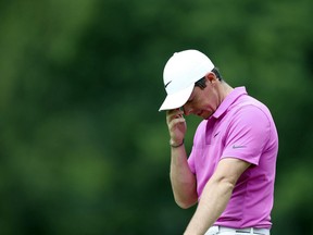 Northern Ireland's Rory McIlroy appears dejected on the fourth green on day four of the PGA Championship at Wentworth Golf Club, England, Sunday May 27, 2018.