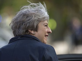 Britain's Prime Minister Theresa May leaves after visiting Brooklands Primary School in Sale, near Manchester, England, as part of the Conservative Party's local election campaign, Monday April 30, 2018.  May on Monday appointed the first ethnic-minority politician to the key post of home secretary, as the government struggled to contain a scandal over the mistreatment of long-term residents from the Caribbean.