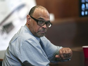 In this May 30, 2018, photo, Shaun Harrison reacts as attorneys give closing arguments in Suffolk Superior Court in the jury trial of him in Boston. Harrison, the former dean at a Boston high school who was known as an anti-violence advocate, has been convicted of shooting and nearly killing a 17-year-old student.