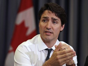 Prime Minister Justin Trudeau gestures during a roundtable discussion with members of the Canadian Technology Accelerator in Cambridge, Mass., Thursday, May 17, 2018.