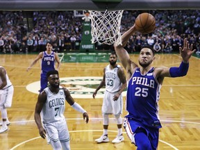 Philadelphia 76ers guard Ben Simmons (25) lines up a dunk after driving past the Boston Celtics during the first quarter of Game 5 of an NBA basketball playoff series in Boston, Wednesday, May 9, 2018.