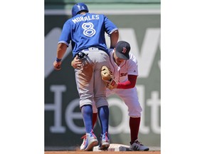 Boston Red Sox second baseman Brock Holt hangs on Toronto Blue Jays designated hitter Kendrys Morales (8) after he was out trying to steal second base in the fifth inning of a baseball game at Fenway Park, Wednesday, May 30, 2018, in Boston.