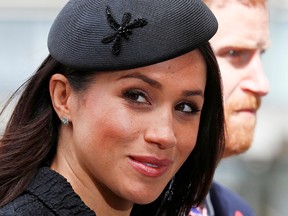 In this file photo taken on April 25, 2018 Britain's Prince Harry (R) and his US fiancee Meghan Markle arrive to attend a service of commemoration and thanksgiving to mark Anzac Day in Westminster Abbey in London on April 25, 2018.