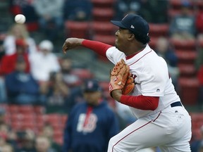 Former Boston Red Sox's Pedro Martinez pitches during a Red Sox alumni baseball game, Sunday, May 27, 2018, in Boston.