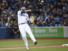 Toronto Blue Jays third baseman Russell Martin, who usually plays catcher, makes a throw to first against the Seattle Mariners on May 9.