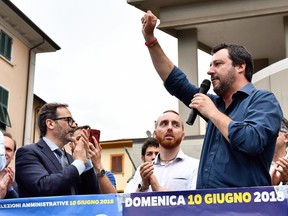 The League leader Matteo Salvini speaks from a stage during a campaign rally for local election in Massa Carrara, Italy, Wednesday, May 30, 2018. Salvini made clear Wednesday he preferred early elections, saying it was up to Italian President Sergio Mattarella to now chart the way forward since he rejected the proposed 5-Star-League cabinet.
