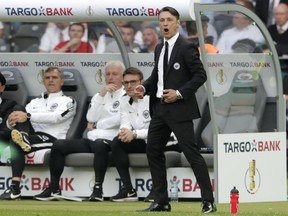 Frankfurt coach Niko Kovac watches his team during the German soccer cup final match between FC Bayern Munich and Eintracht Frankfurt in Berlin, Germany, Saturday, May 19, 2018.