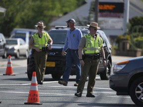 Maryland State Police divert traffic at Belair Road and Chapel Road after a Baltimore County officer was killed in Perry Hall, Md., May 21, 2018.