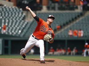 Baltimore Orioles starting pitcher David Hess throws to the Tampa Bay Rays in the first inning of the first baseball game of a doubleheader, Saturday, May 12, 2018, in Baltimore.