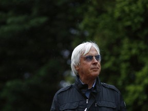 Bob Baffert, trainer of Kentucky Derby winner Justify, stands outside a barn, Friday, May 18, 2018, at Pimlico Race Course in Baltimore. The Preakness Stakes horse race is scheduled to take place Saturday, May 19.