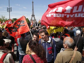 Railway workers stage a protest in Paris, France on Thursday, May 3, 2018. French rail workers set up street protests across France on Thursday as they resumed their rolling strike against President Emmanuel Macron's plans to revamp national railway company SNCF. The Eiffel Tower is in the background.