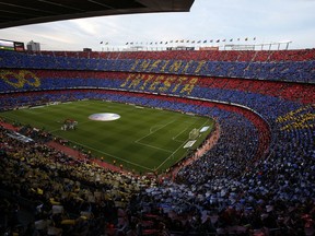 FC Barcelona's supporters pay tribute to Barcelona's Andres Iniesta prior of the Spanish La Liga soccer match between FC Barcelona and Real Sociedad at the Camp Nou stadium in Barcelona, Spain, Sunday, May 20, 2018. Iniesta announced last month he would leave Barcelona after 16 seasons.