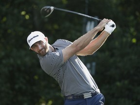 Dustin Johnson hits from the 11th tee during the first round of The Players Championship golf tournament Thursday, May 10, 2018, in Ponte Vedra Beach, Fla.