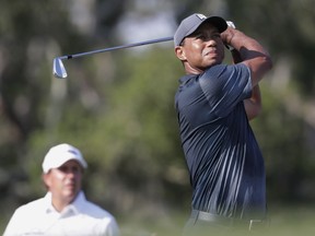 Tiger Woods hits from the 12th tee during the second round of The Players Championship golf tournament Friday, May 11, 2018, in Ponte Vedra Beach, Fla.