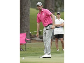 Webb Simpson watches his putt on the 15 green, during the final round of The Players Championship golf tournament Sunday, May 13, 2018, in Ponte Vedra Beach, Fla.