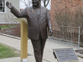 In a photo from, Friday, April 27, 2018, a statue of former Mayor Orville Hubbard, who spent decades trying to keep the city all white, is displayed in Dearborn, Mich. The statue was socked away for more than a year after leaders decided it didn't belong outside a new City Hall. Vestiges of racism and intolerance are slowly being moved and removed in Michigan and other northern states as calls continue in the South to take down such monuments.