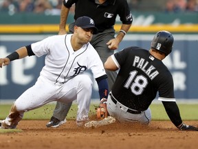 Detroit Tigers shortstop Jose Iglesias, left, tags out Chicago White Sox's Daniel Palka (18) at second base in the fifth inning of a baseball game in Detroit, Friday, May 25, 2018.