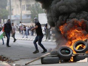Palestinians clash with Israeli troops following a protest against the U.S. decision to relocate it's Israeli embassy to Jerusalem, in the West Bank city of Bethlehem, Monday, May 14, 2018. Several thousand people gathered in the center of Ramallah, while hundreds marched to the Qalandiya crossing on the outskirts of Jerusalem, where protesters threw stones at Israeli troops with their anger fueled by the embassy opening.