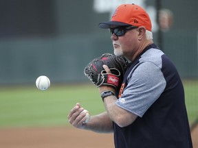 Detroit Tigers manager Ron Gardenhire tosses the ball to a coach hitting fly balls during practice before the Tigers' baseball game against the Minnesota Twins Monday, May 21, 2018, in Minneapolis. Gardenhire is going against his former team, the Minnesota Twins, as a manager for the first time as the Detroit Tigers start a three-game series at Target Field. Gardenhire spent 13 seasons managing the Twins.