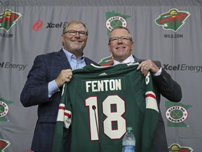 Minnesota Wild NHL hockey team owner Craig Leipold, left, poses with new general manager Paul Fenton during an introductory press conference in St. Paul, Minn., Tuesday, May 22, 2018.