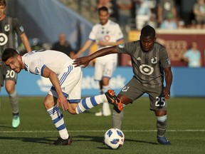 Montreal Impact midfielder Alejandro Silva (9) and Minnesota United midfielder Darwin Quintero (25) vie for the ball during the first half of an MLS soccer match Saturday, May 26, 2018, in Minneapolis.