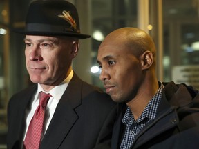 FILE - In this March 21, 2018, file photo, former Minneapolis Police Officer Mohamed Noor, right, leaves the Hennepin County Public Safety Facility with his attorney, Thomas Plunkett, after posting bail in Minneapolis. Noor, who is charged with third-degree murder and second-degree manslaughter in the July 15, 2017, killing of Justine Ruszczyk Damond, of Australia, is scheduled to appear in court Tuesday, May 8, 2018.