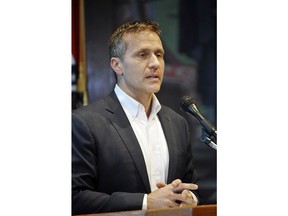 Missouri Gov. Eric Greitens reads from a prepared statement as he announces his resignation during a news conference, Tuesday, May 29, 2018, at the state Capitol, in Jefferson City, Mo. Greitens resigned amid a widening investigation that arose from an affair with his former hairdresser. Greitens said his resignation would take effect Friday.