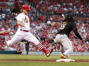 St. Louis Cardinals' Harrison Bader, left, is safe at first for a single as Pittsburgh Pirates first baseman Josh Bell waits for the throw during the fourth inning of a baseball game Thursday, May 31, 2018, in St. Louis.